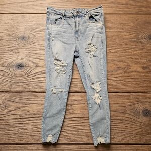 AMERICAN EAGLE Light Blue Distressed Skinny Jeans. Super High Rise Jeggings.
